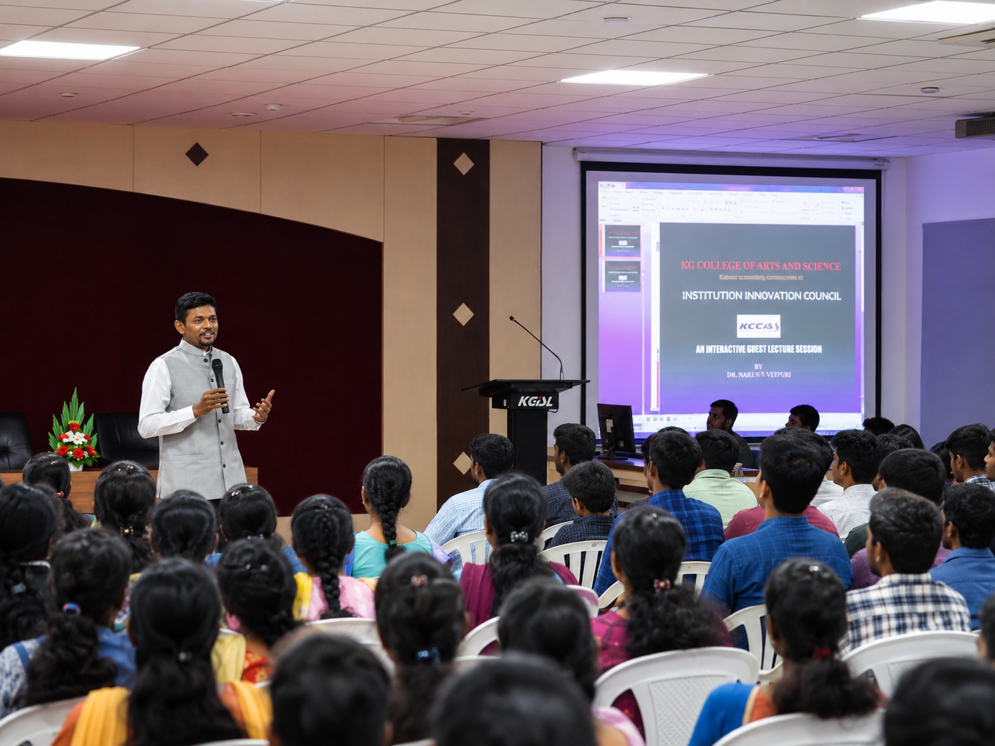Dr. Ashwin Nithish addressing a full auditorium of students at KG College of Arts and Science